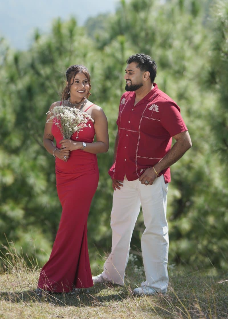 Samriti holding white flowers beside Sarthak